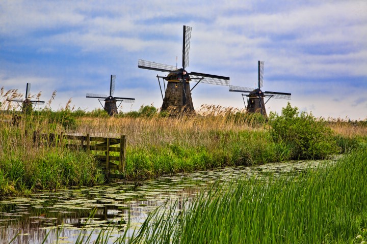 Windmills on the Kinderdĳk in the western Netherlands. The 19 old windmills here are the largest concentration of historic windmills in the country and were declared a UNESCO World Heritage Site in 1997.