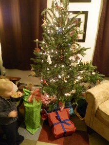 Fiona eats a cookie as she prepares to open her presents on Christmas Eve.