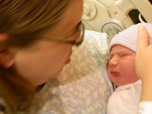 14.34  |  2 January  Susan holds Colin again after his first bath.