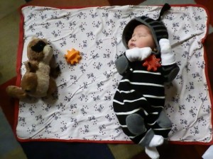 And battling: Ninja Colin uses ninja stars to fight off a masked intruder.