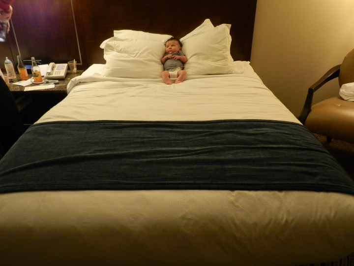 Colin hangs out on the bed in our hotel room in New Haven, Connecticut.