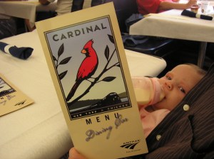 Fiona rides in Daddy's lap on the dining car of Amtrak's Cardinal on the way back from her first overnight trip, to Charleston, West Virginia, on 24 September 2010, when she was barely two months old.